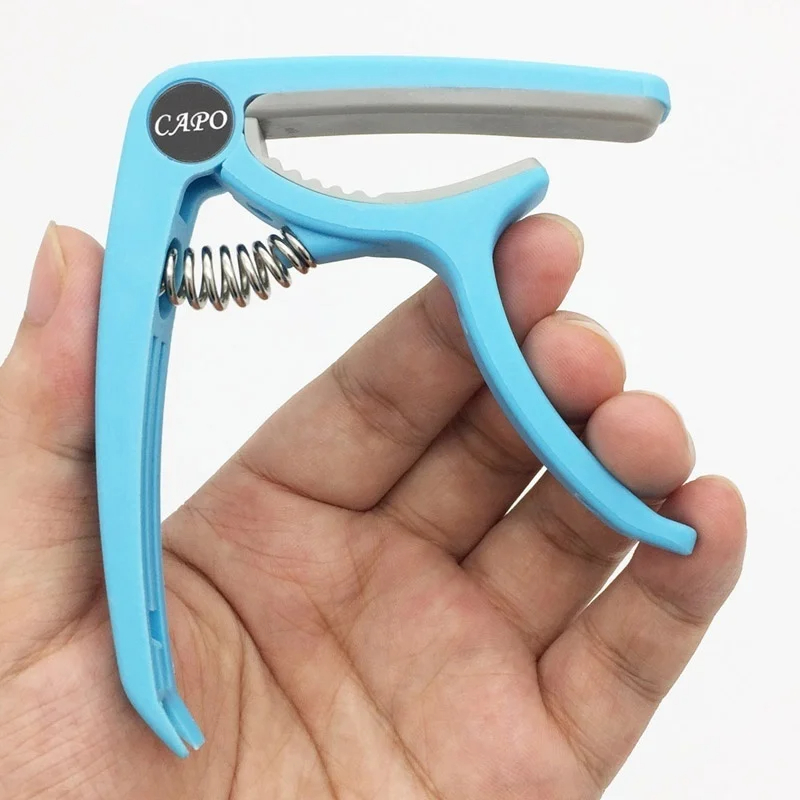 Capodastre de guitare en plast - Musical Instrument Gif avis et prix